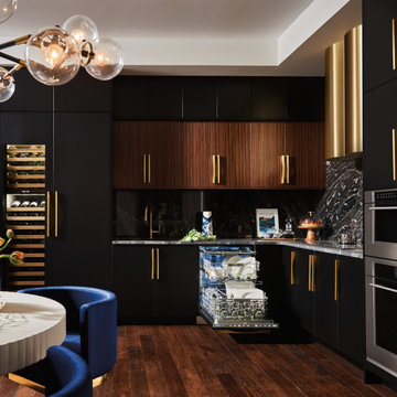 Modern dark, black, wood kitchen with gold accents and Sub-Zero wine storage