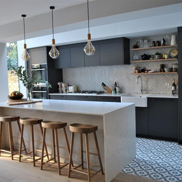 Modern dark grey kitchen with black handles