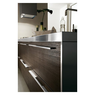 Modern dark wood kitchen with stainless steel counter and white