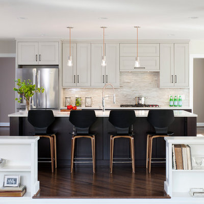 Large transitional galley dark wood floor open concept kitchen photo in DC Metro with a double-bowl sink, shaker cabinets, gray cabinets, quartz countertops, mosaic tile backsplash, stainless steel appliances, beige backsplash and an island