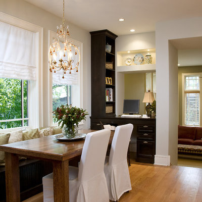 Example of a large classic galley light wood floor eat-in kitchen design in Chicago with a farmhouse sink, shaker cabinets, dark wood cabinets and an island