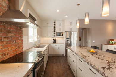 Eat-in kitchen - mid-sized modern l-shaped medium tone wood floor eat-in kitchen idea in Calgary with an undermount sink, flat-panel cabinets, white cabinets, concrete countertops, white backsplash, subway tile backsplash, stainless steel appliances and an island