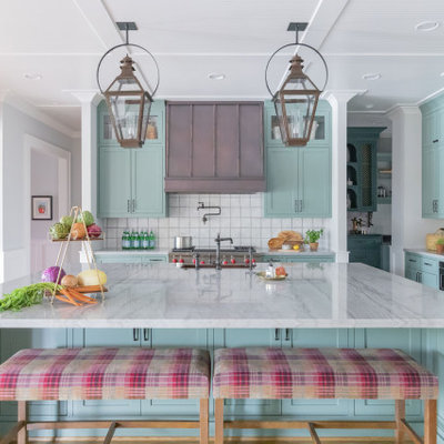 Large cottage l-shaped light wood floor and beige floor open concept kitchen photo in Houston with stainless steel appliances, a farmhouse sink, shaker cabinets, turquoise cabinets, marble countertops, white backsplash, ceramic backsplash, an island and white countertops