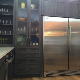 Inspiration for a midcentury kitchen in DC Metro with flat-panel cabinets, grey cabinets, quartz benchtops, grey splashback and cement tile splashback.