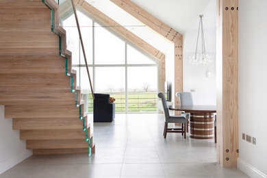 This is an example of a large contemporary kitchen in Other with porcelain flooring and an island.