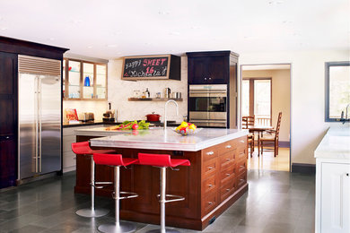 Example of an eclectic kitchen design in Toronto with stainless steel appliances