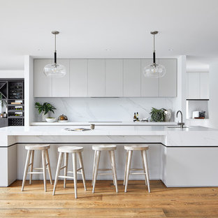 Design ideas for a large contemporary galley kitchen in Melbourne with with island.
