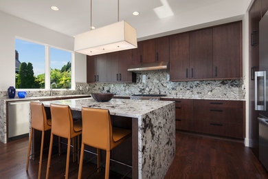 Example of a large minimalist kitchen design in Seattle with an island