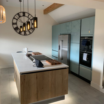 Modern/industrial style two tone kitchen with American fridge/freezer and downdr