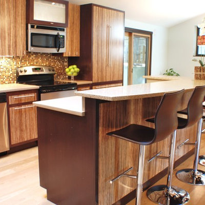 Eat-in kitchen - contemporary eat-in kitchen idea in Boise with flat-panel cabinets, medium tone wood cabinets, multicolored backsplash and stainless steel appliances