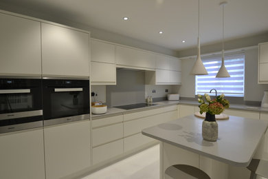 Modern kitchen, handleless design with Corian worktops and Miele appliances