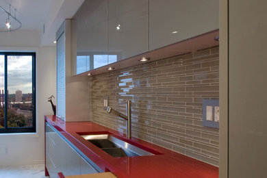 Example of a trendy kitchen design in Minneapolis with gray backsplash and glass tile backsplash