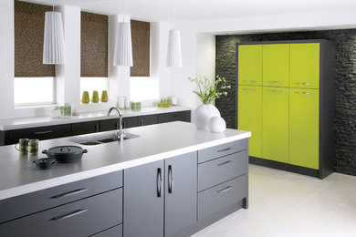This is an example of a modern kitchen in Other with a built-in sink, flat-panel cabinets, grey cabinets, quartz worktops, stainless steel appliances, porcelain flooring and an island.