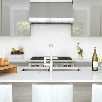 Inspiration for a modern kitchen remodel in Dallas with a double-bowl sink, flat-panel cabinets, gray cabinets and white backsplash