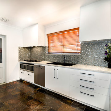 Modern Kitchen Renovation | Caesarstone Benchtops | Black Tapware | Slate Floors
