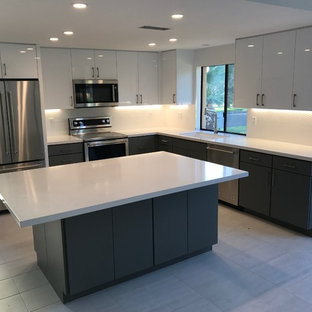 Large modern eat-in kitchen inspiration - Inspiration for a large modern l-shaped porcelain tile and gray floor eat-in kitchen remodel in Other with an undermount sink, flat-panel cabinets, white cabinets, quartzite countertops, white backsplash, stainless steel appliances and an island
