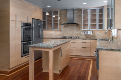 Example of a large minimalist u-shaped medium tone wood floor eat-in kitchen design in Other with an undermount sink, flat-panel cabinets, light wood cabinets, quartzite countertops, beige backsplash, limestone backsplash, stainless steel appliances, an island and blue countertops