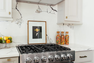 Eat-in kitchen - mid-sized modern l-shaped medium tone wood floor eat-in kitchen idea in New York with a double-bowl sink, raised-panel cabinets, gray cabinets, quartz countertops, multicolored backsplash, stone slab backsplash, stainless steel appliances, an island and multicolored countertops