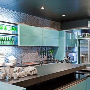 Modern kitchen with blue cabinets and stone mosaic backsplash