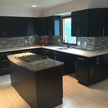 Modern Kitchen with Ebony Cabinet and Glass Tile Backsplash