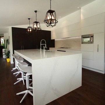 Modern Kitchen with large island bench in calacatta