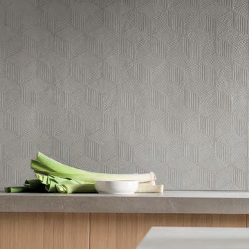 Modern kitchen with lightly textured cement look porcelain tile backsplash