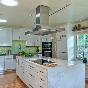 Modern Kitchen with Marble Counters and Floating Range Hood