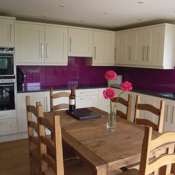 modern kitchen with purple splashback