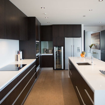 Modern Kitchen with White Benchtops & Dark Wood