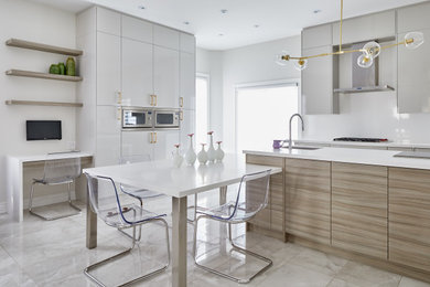 Open concept kitchen - mid-sized contemporary l-shaped gray floor open concept kitchen idea in Toronto with an undermount sink, flat-panel cabinets, white cabinets, quartz countertops, an island, white countertops, white backsplash and stainless steel appliances