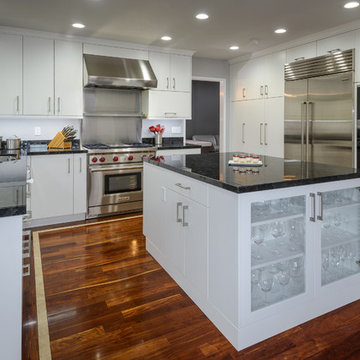 Modern L-Shaped Kitchen with White Cabinets and Black Countertops