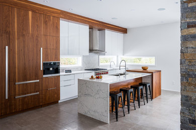 Mid-sized minimalist single-wall ceramic tile and beige floor eat-in kitchen photo in Burlington with a drop-in sink, flat-panel cabinets, dark wood cabinets, granite countertops, white backsplash, marble backsplash, stainless steel appliances, an island and gray countertops