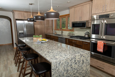 Example of a mid-sized minimalist l-shaped enclosed kitchen design in Other with flat-panel cabinets, brown cabinets, granite countertops, gray backsplash, glass tile backsplash, an island and white countertops