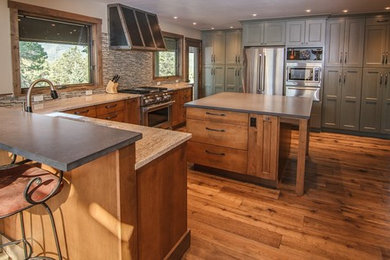 Inspiration for a large modern u-shaped dark wood floor and brown floor eat-in kitchen remodel in Other with stainless steel appliances, an island, an undermount sink, medium tone wood cabinets, granite countertops, multicolored backsplash, matchstick tile backsplash and recessed-panel cabinets