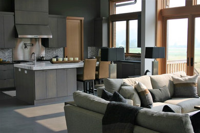 This is an example of a medium sized modern single-wall open plan kitchen in Austin with a submerged sink, flat-panel cabinets, grey cabinets, marble worktops, grey splashback, metal splashback, concrete flooring, an island, grey floors and white worktops.