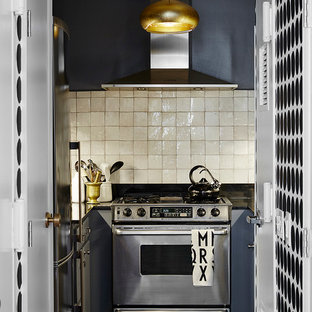 Small scandinavian enclosed kitchen ideas - Inspiration for a small scandinavian u-shaped slate floor enclosed kitchen remodel in New York with beige backsplash, stainless steel appliances, no island, raised-panel cabinets, gray cabinets, granite countertops and ceramic backsplash