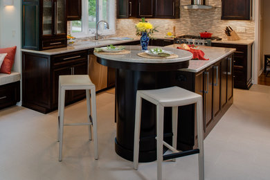 Eat-in kitchen - mid-sized modern l-shaped ceramic tile eat-in kitchen idea in Detroit with an undermount sink, recessed-panel cabinets, dark wood cabinets, quartzite countertops, green backsplash, mosaic tile backsplash, stainless steel appliances and an island