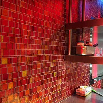Modern red kitchen with mosaic tile