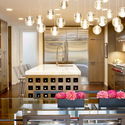 Mid-sized trendy u-shaped dark wood floor open concept kitchen photo in Chicago with flat-panel cabinets, light wood cabinets, stainless steel appliances, an undermount sink, marble countertops, beige backsplash and an island