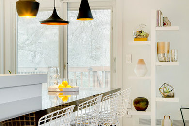 Example of a small danish l-shaped light wood floor eat-in kitchen design in Minneapolis with an undermount sink, glass-front cabinets, white cabinets, quartz countertops, white backsplash, white appliances and an island