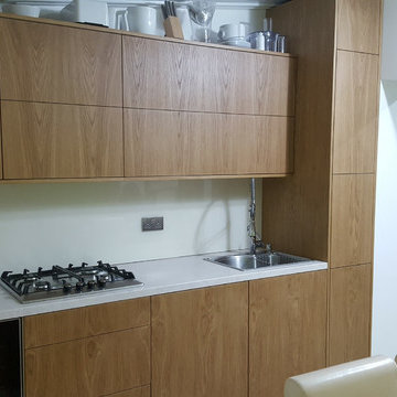 Modern style natural Oak veneer kitchen.
