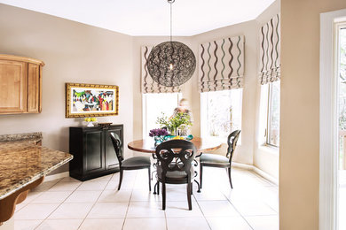Example of a transitional porcelain tile dining room design in Chicago