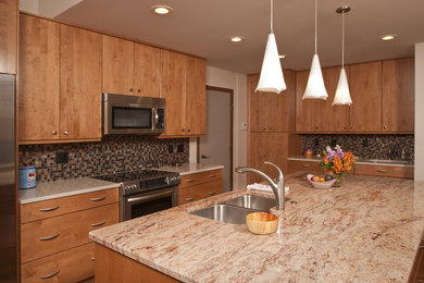 Large minimalist u-shaped medium tone wood floor eat-in kitchen photo in Detroit with a double-bowl sink, flat-panel cabinets, multicolored backsplash, glass tile backsplash, stainless steel appliances, an island, light wood cabinets and quartz countertops