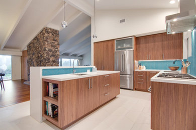 Inspiration for a large retro u-shaped open plan kitchen in Tampa with a submerged sink, flat-panel cabinets, dark wood cabinets, blue splashback, glass sheet splashback, stainless steel appliances, porcelain flooring and multiple islands.