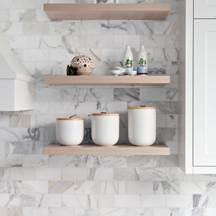 This is an example of a small modern u-shaped eat-in kitchen in Vancouver with a single-bowl sink, shaker cabinets, white cabinets, quartz benchtops, multi-coloured splashback, ceramic splashback, stainless steel appliances, plywood floors, with island, beige floor and grey benchtop.