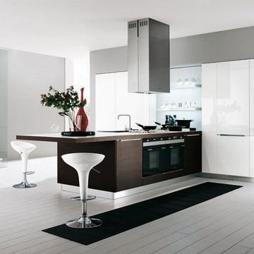 Modern white and brown kitchen with high gloss cabinets