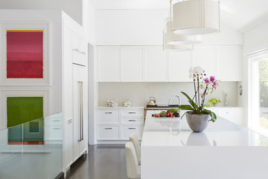 Transitional exposed beam kitchen photo in Chicago with white backsplash, stainless steel appliances and an island