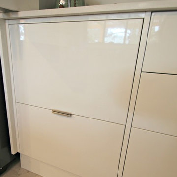 Modern White Kitchen - Microwave hidden by pocket door