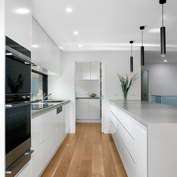 Modern White Kitchen with Window Splashback