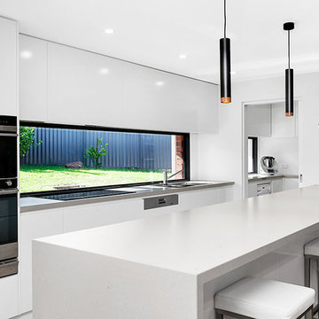 Modern White Kitchen with Window Splashback